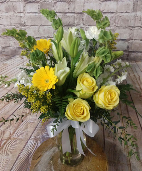 “Springtime Sunrise”<br />
If your special someone is the sun that rises and sets in your life, this arrangement reflects the beauty of a springtime sunrise and is sure to please her. $75